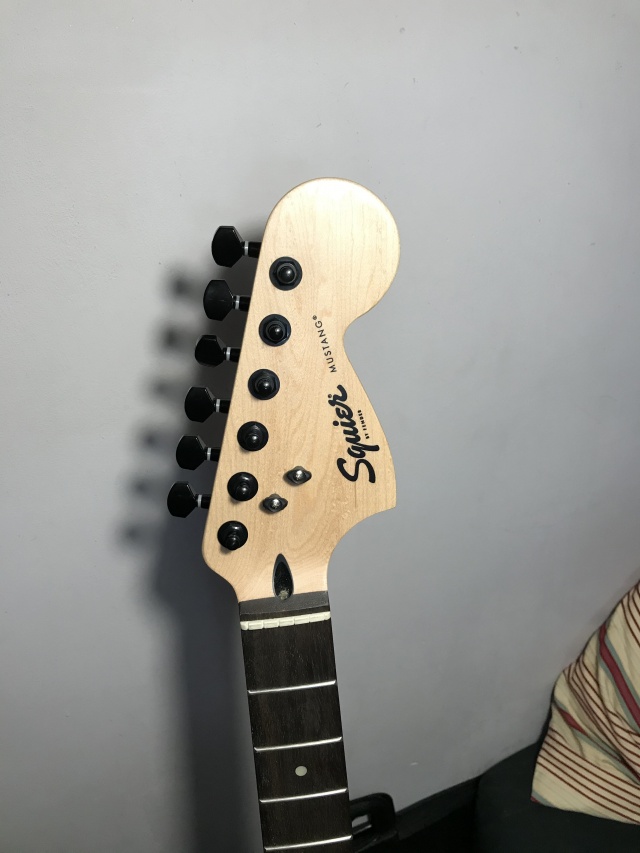 Squier Bullet Mustang headstock with black locking tuners and